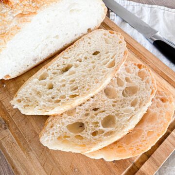No-knead artisan sourdough bread on a wooden cutting board