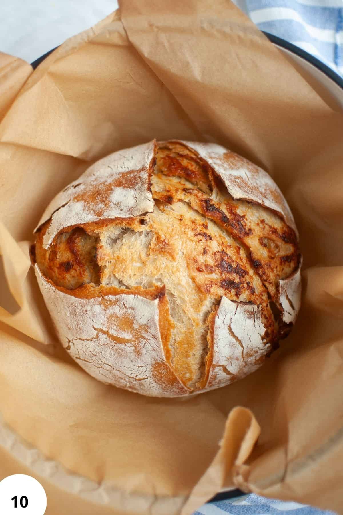 Fresh sourdough bread with roasted garlic and Parmesan cheese, crusty and golden.