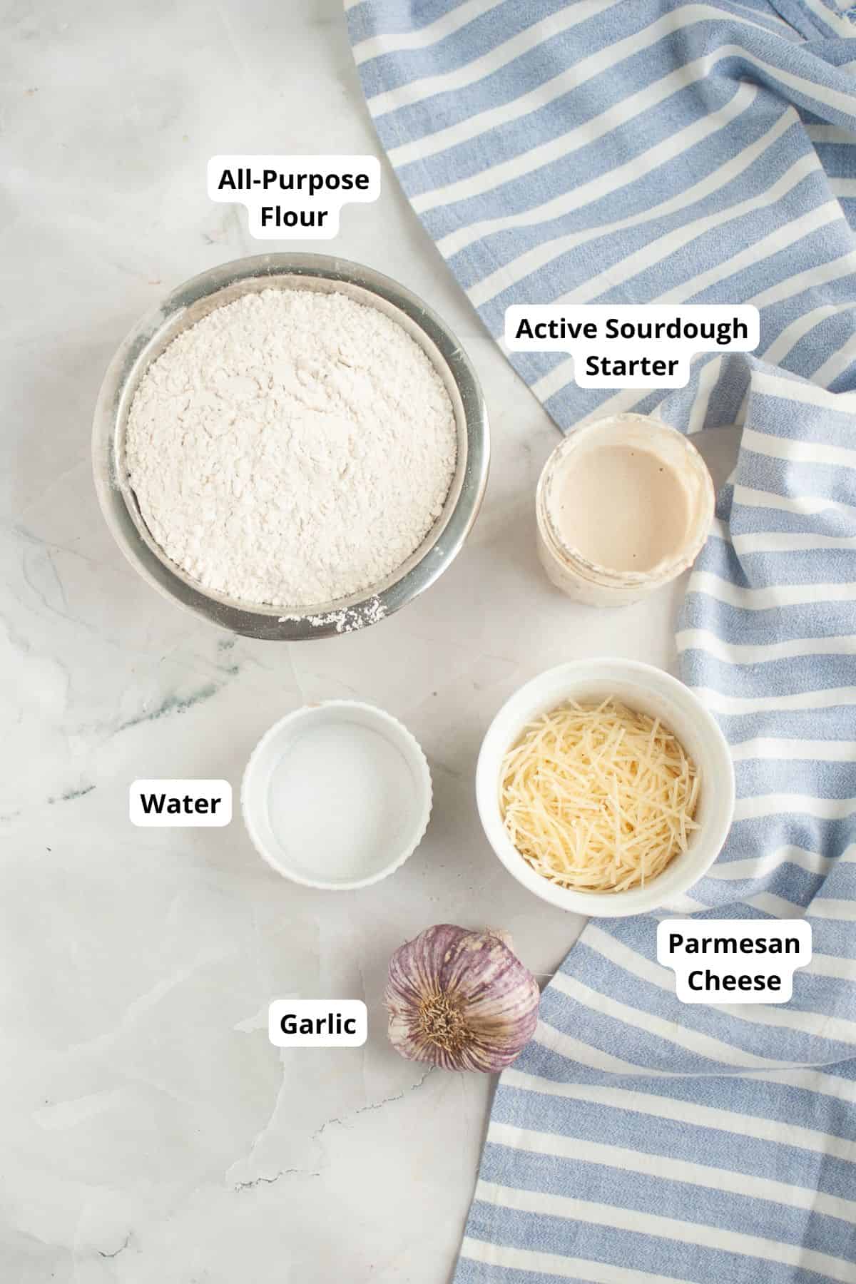 Active sourdough starter and all-purpose flour for bread making.