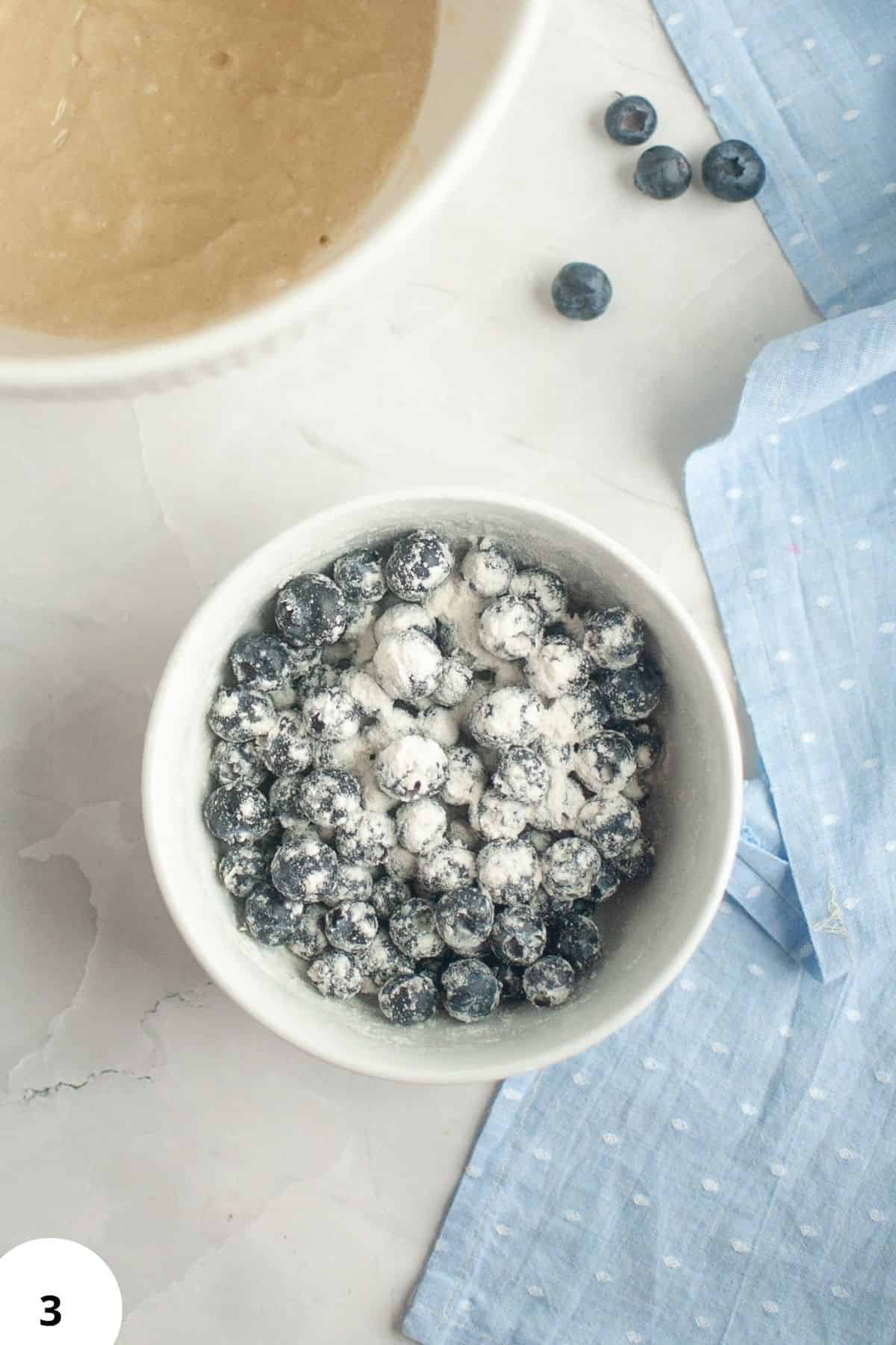 Blueberries in a bowl ready for baking sourdough discard blueberry lemon quick bread.