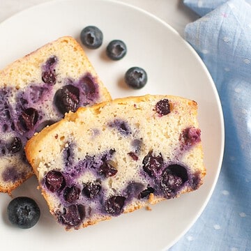 Blueberry lemon quick bread with sourdough discard, fresh blueberries, and lemon zest. Perfect for b.