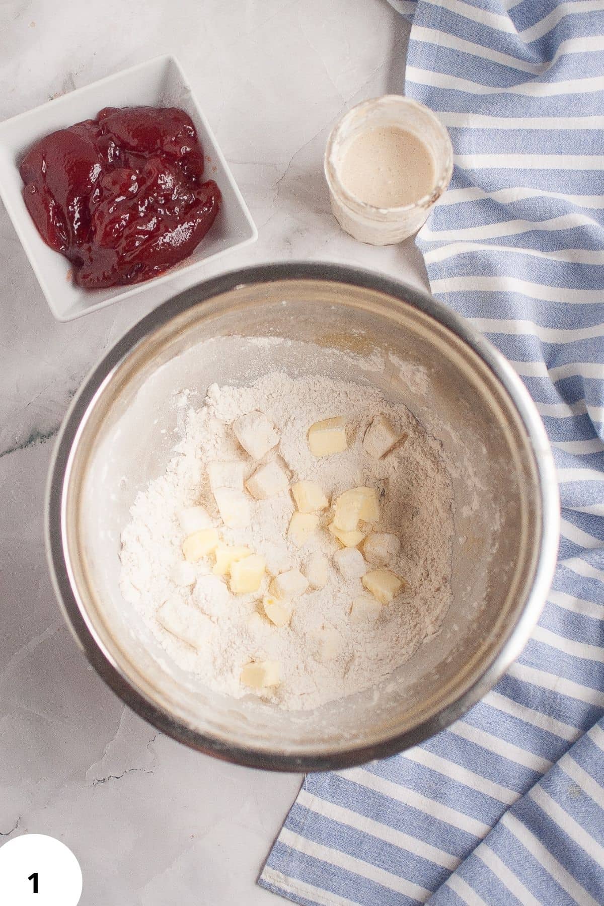 Dough being stretched and folded for sourdough bread preparation.