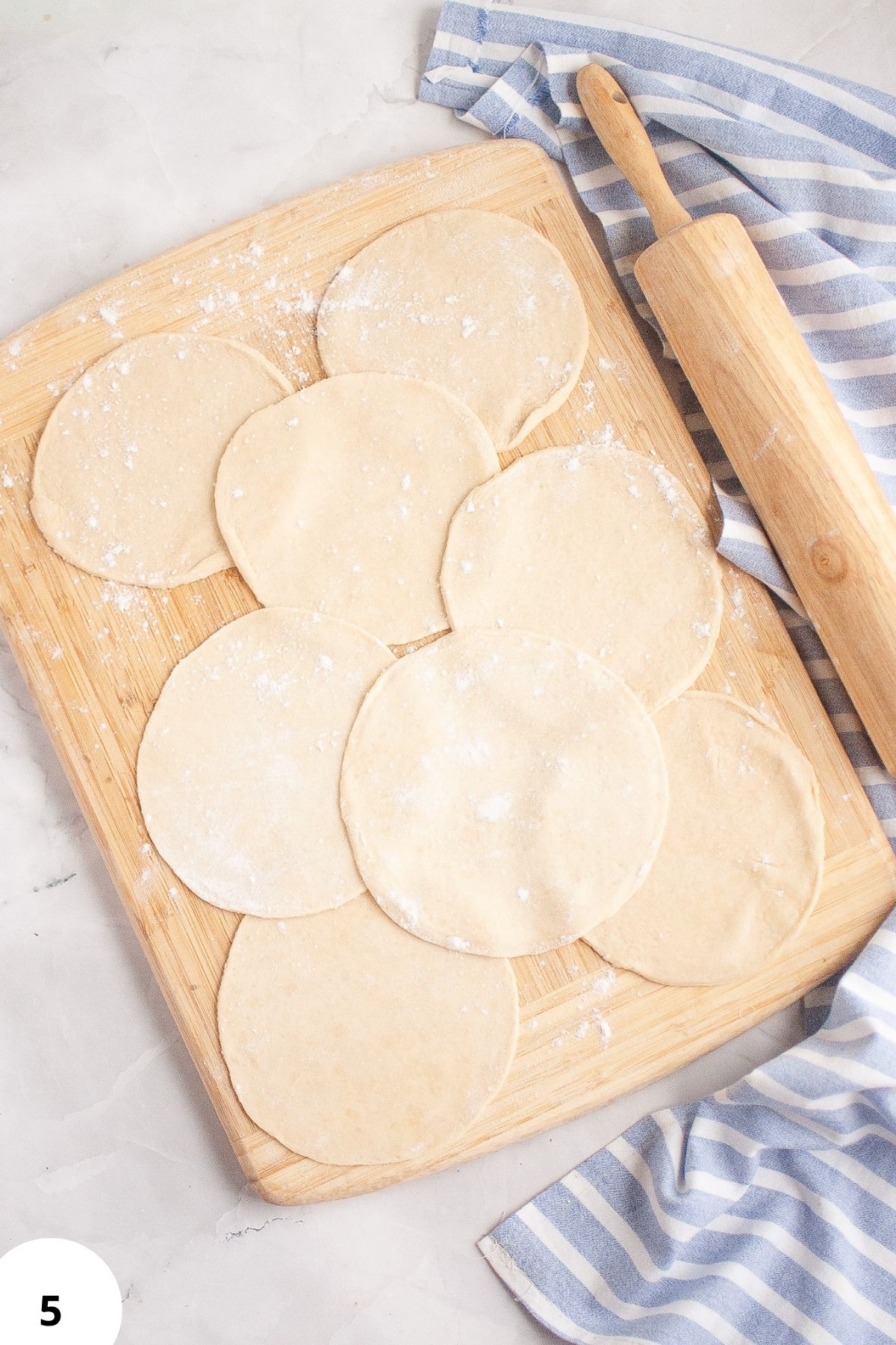 Preparing dough with stretch and folds for sourdough bread.