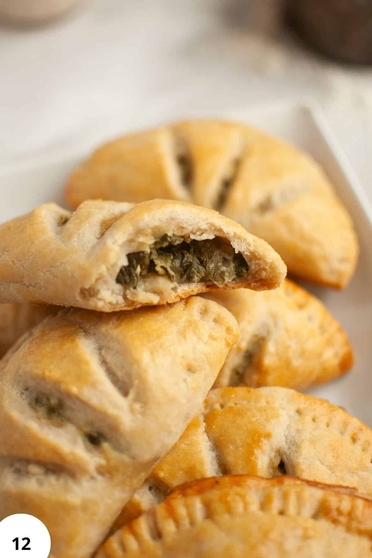 Delicious sourdough hand pies filled with spinach and feta cheese, perfect for a savory snack or mea.