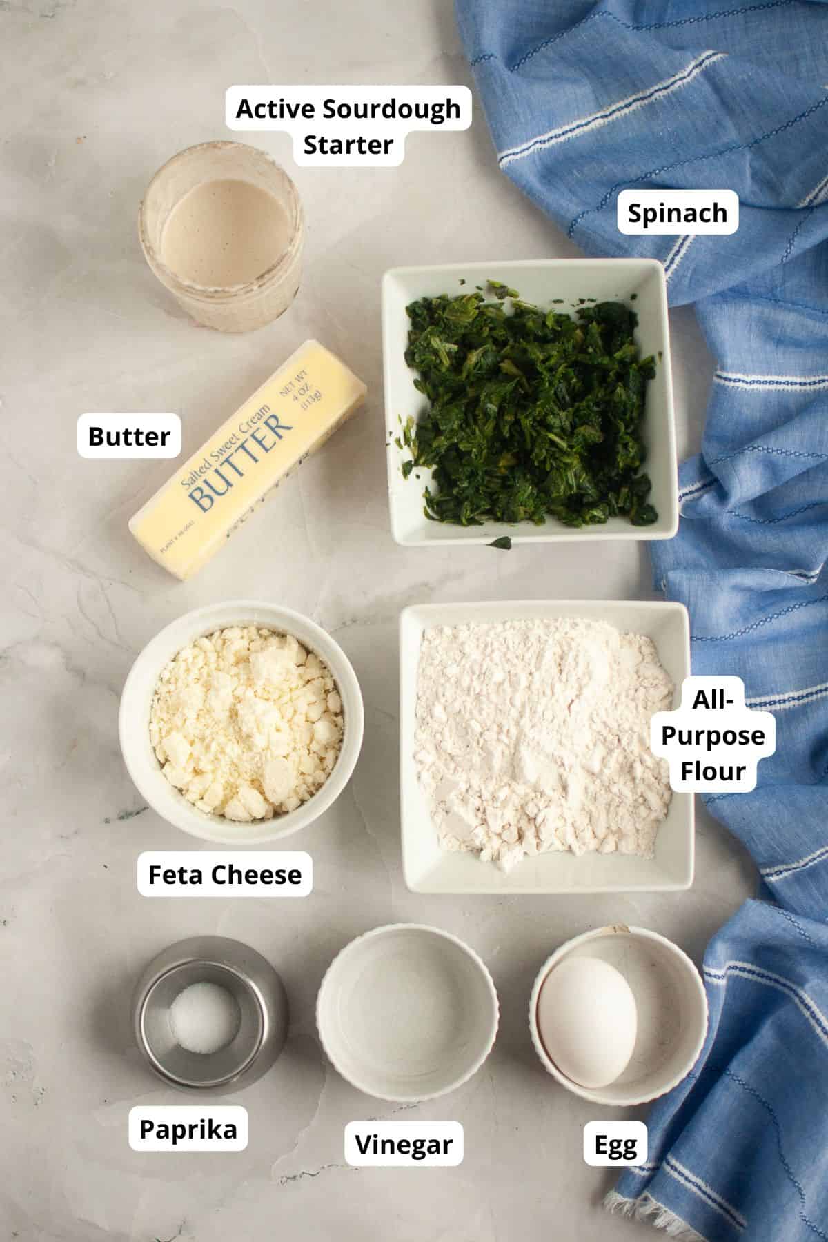 Ingredients for savory sourdough hand pies with spinach and feta cheese.