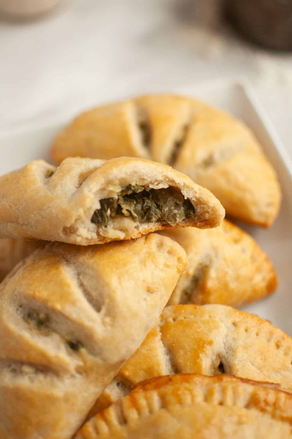 Delicious sourdough hand pies filled with spinach and feta cheese, perfect for a savory snack or mea.