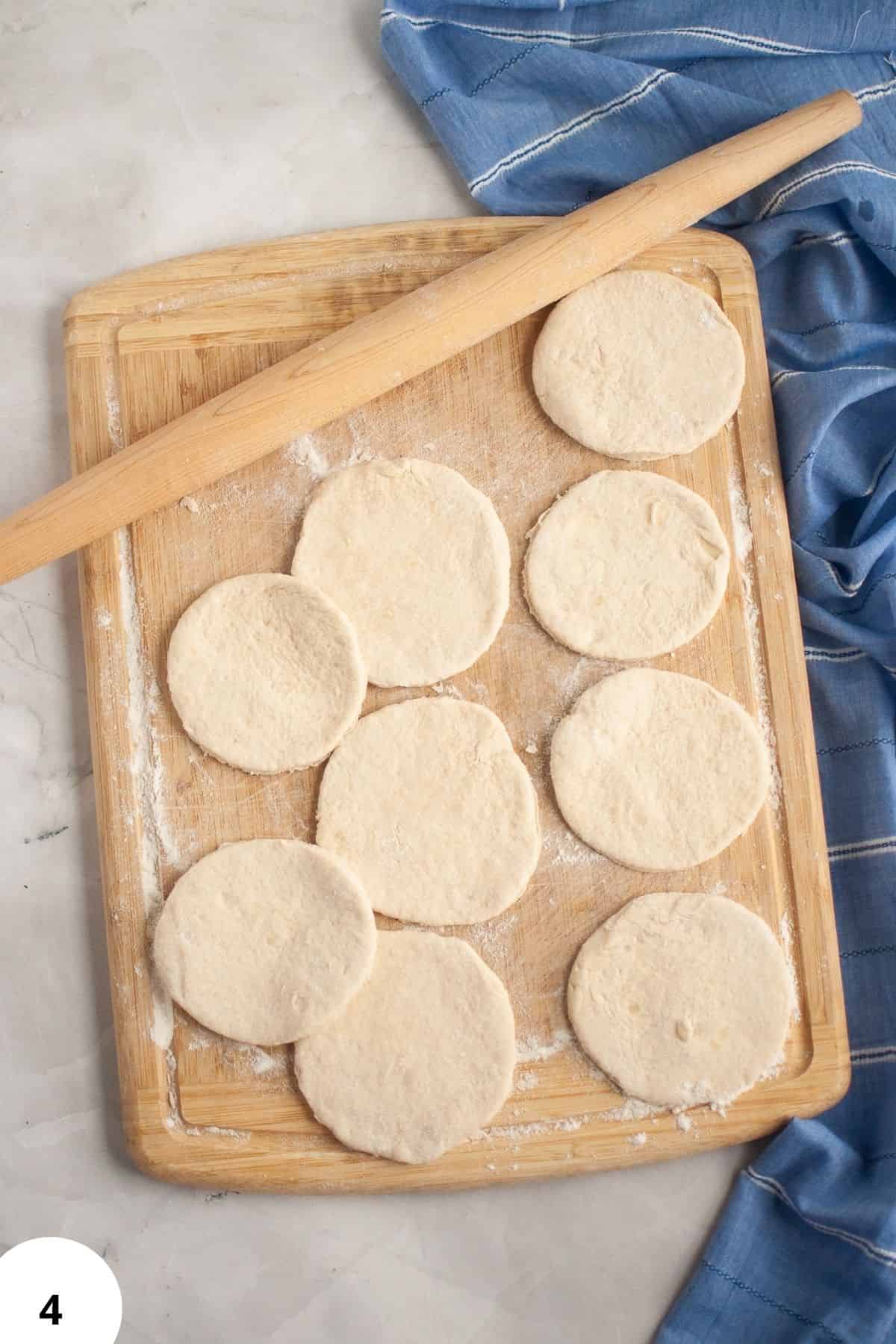 Sourdough dough rounds ready for shaping on a wooden board.