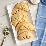 Delicious sourdough hand pies filled with spinach and feta cheese, perfect for a savory snack or mea.