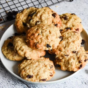 Sourdough oatmeal raisin cookies on a small plate.
