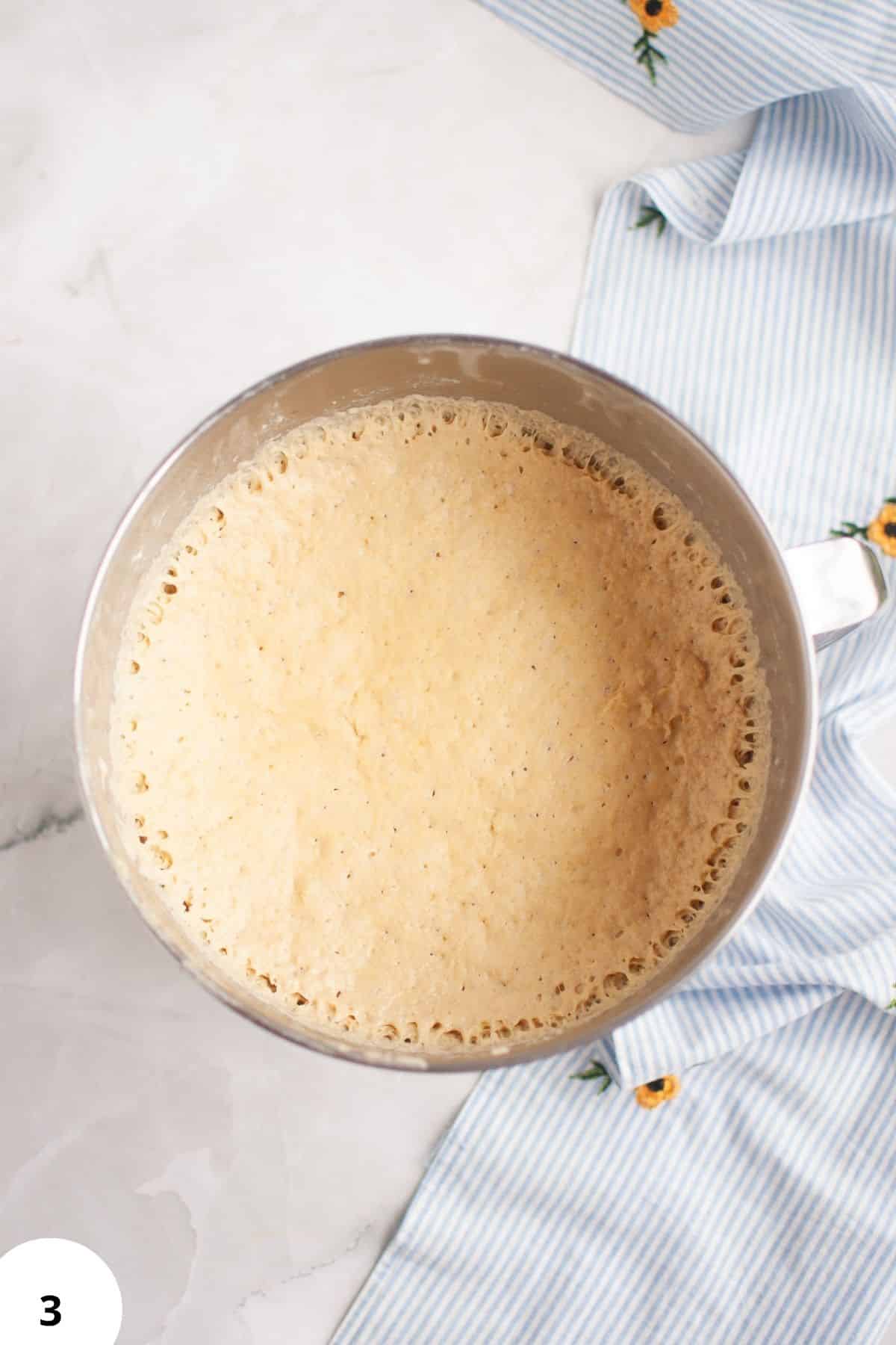 Sourdough bread dough undergoing stretch and folds for gluten development.