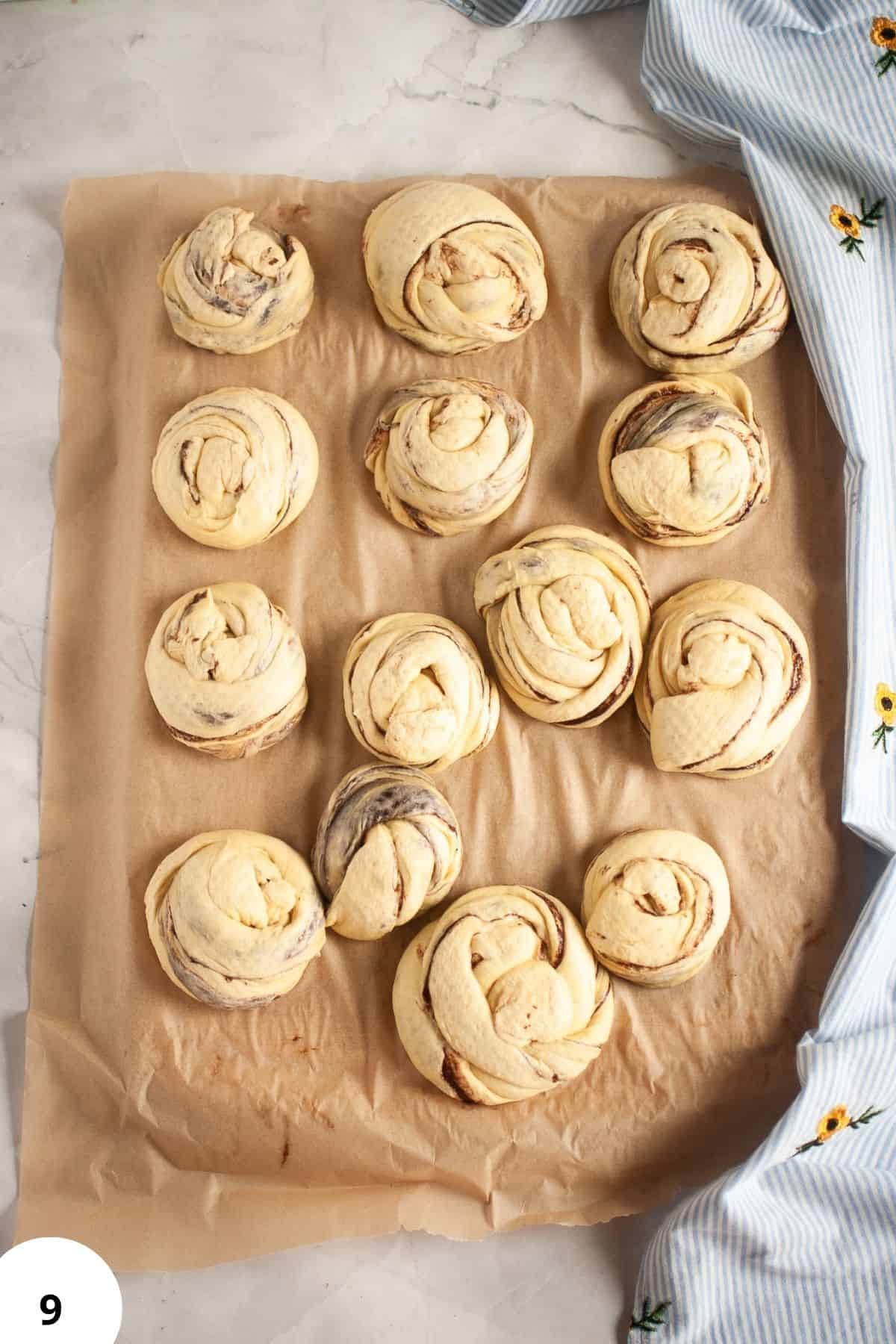 Sourdough bread dough with stretch and folds process on parchment paper.