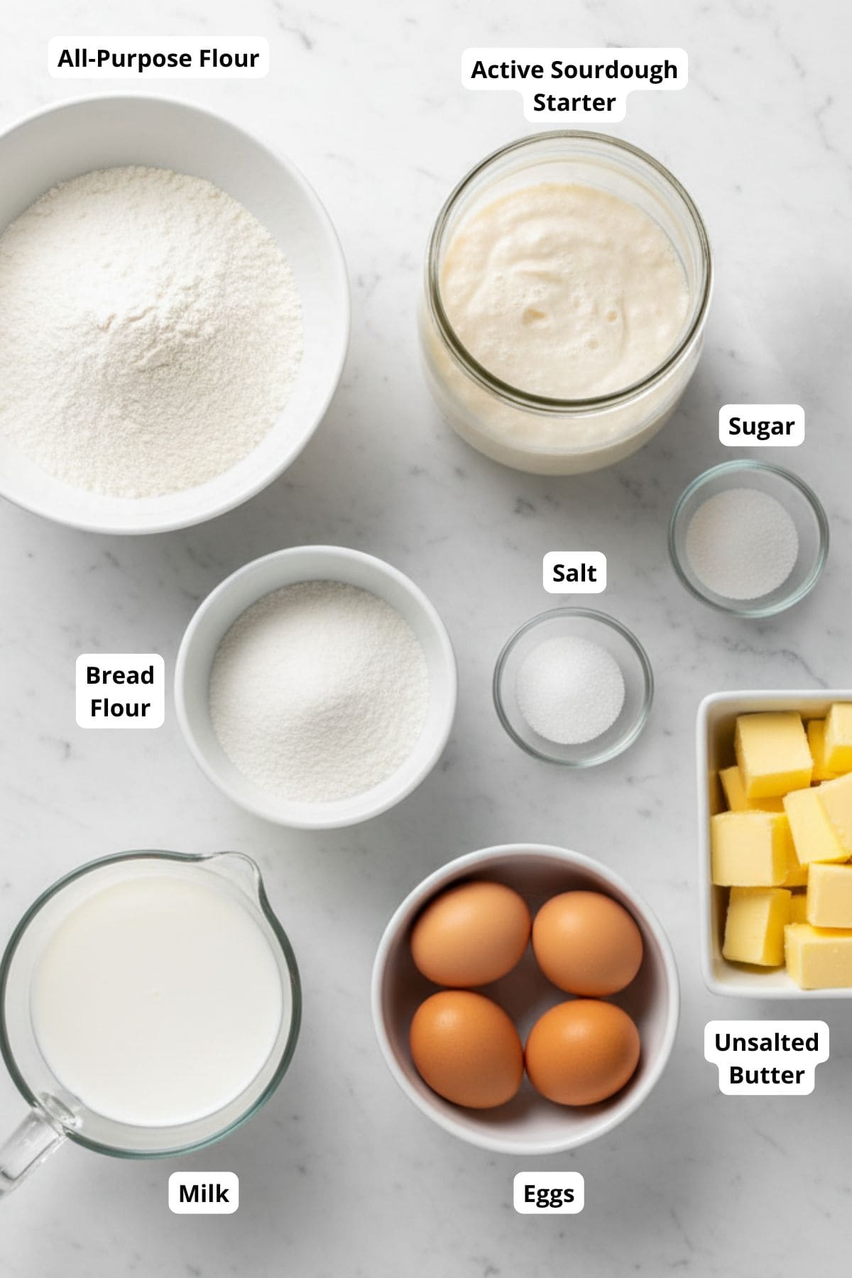 Ingredients for making a sourdough easter braided bread arranged in a surface.