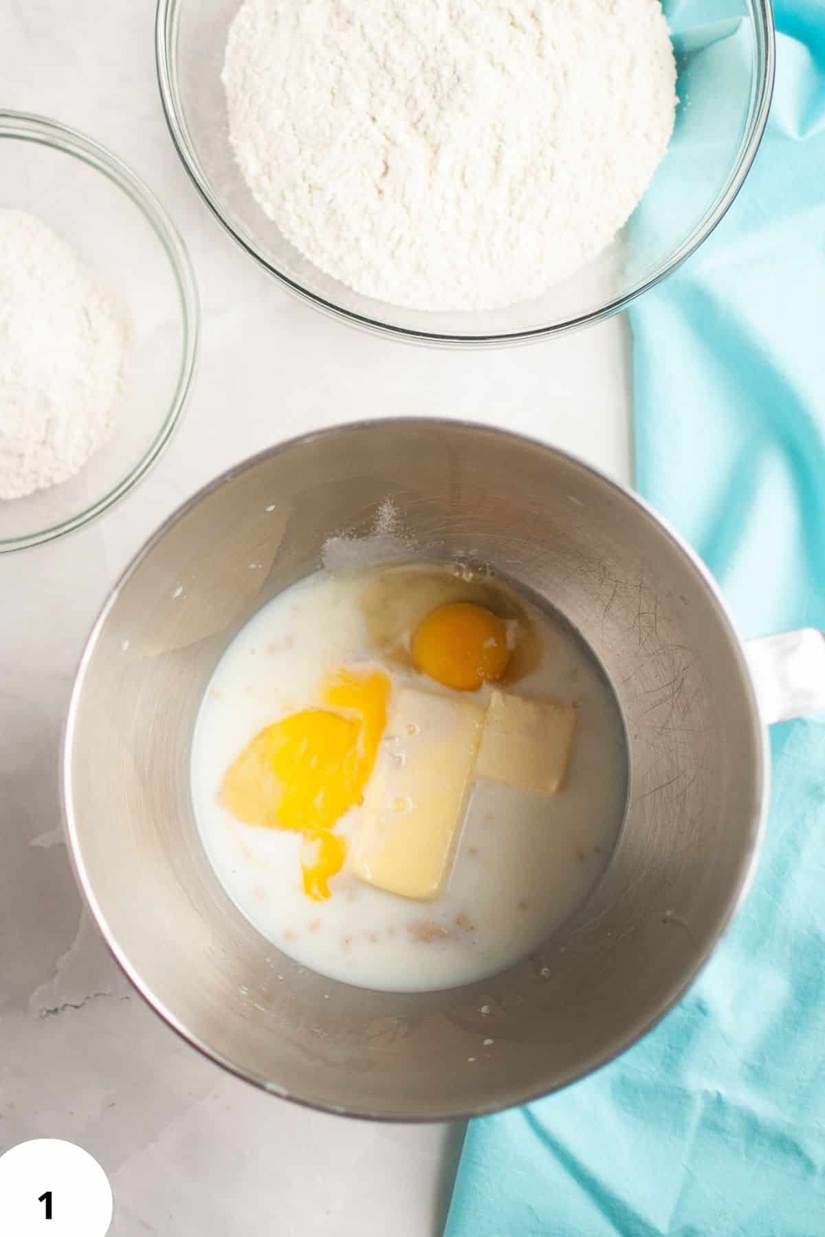 Dough with eggs and butter in a mixing bowl for bread making.
