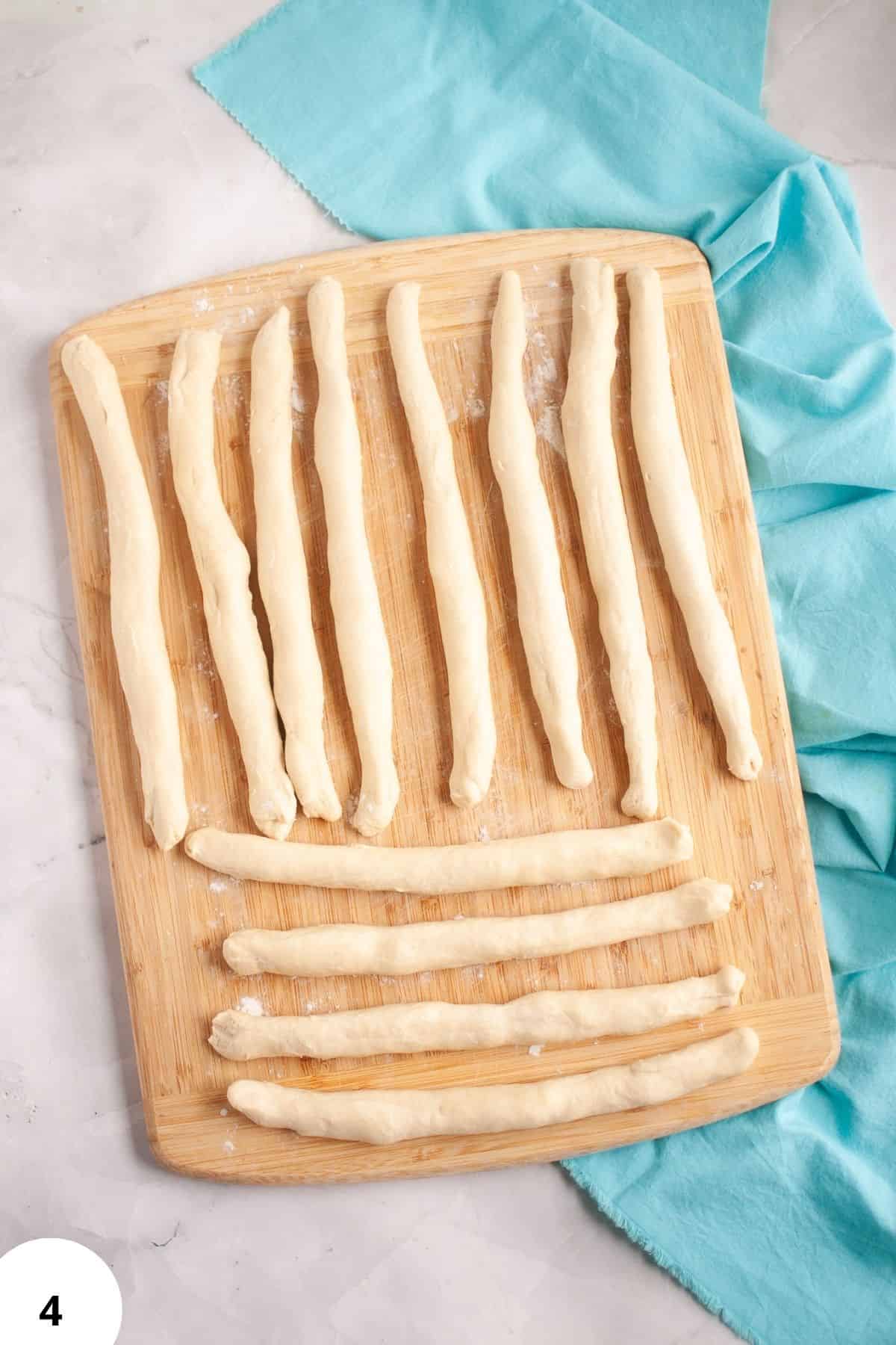 Dough strips prepared for shaping with stretch and fold technique.