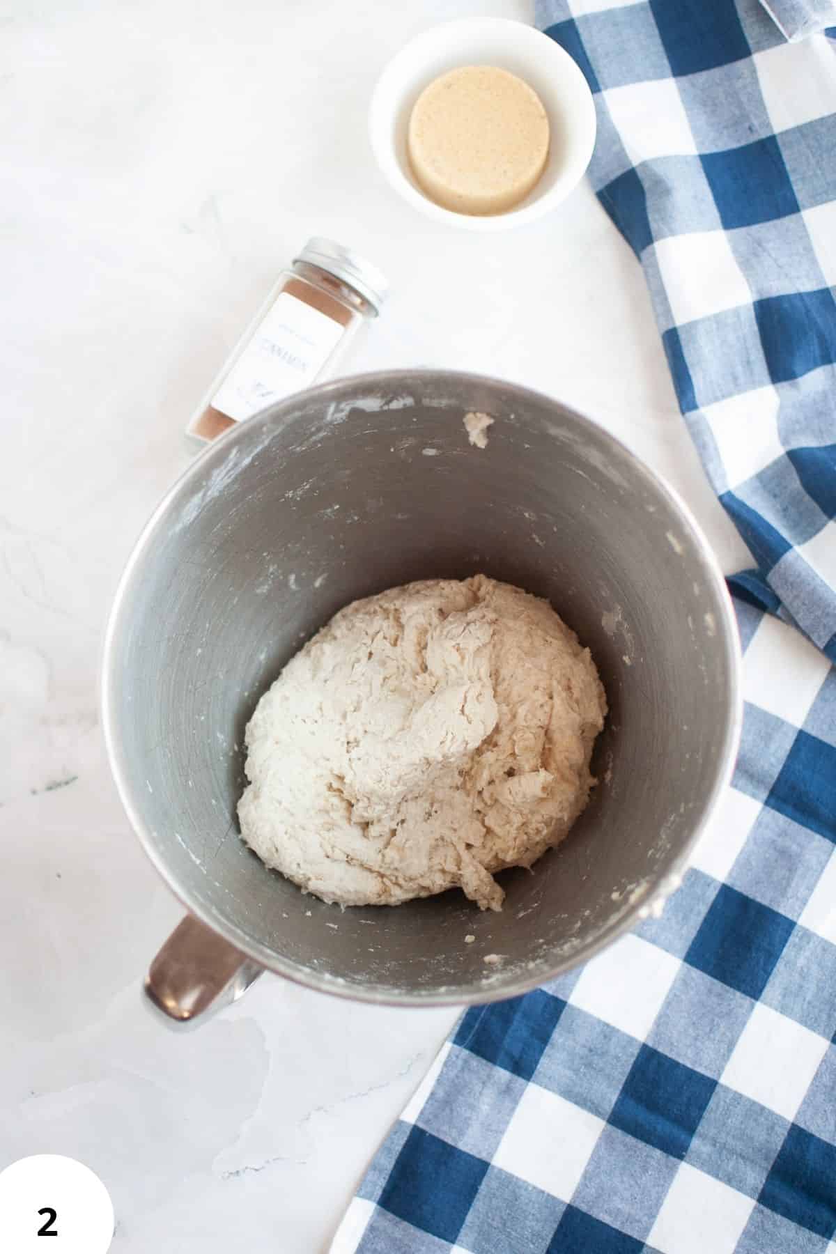 Dough in mixing bowl for stretch and folds bread technique.