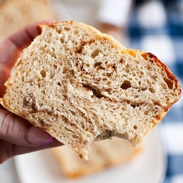 Artisan bread with open crumb structure and crust, perfect for bread baking enthusiasts.