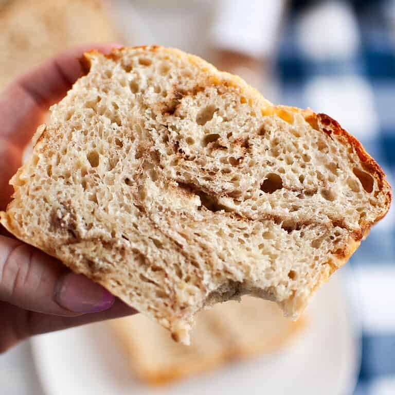 Artisan bread with open crumb structure and crust, perfect for bread baking enthusiasts.