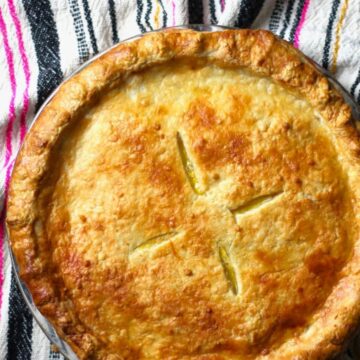 Sourdough pie crust pie on a tea towel.