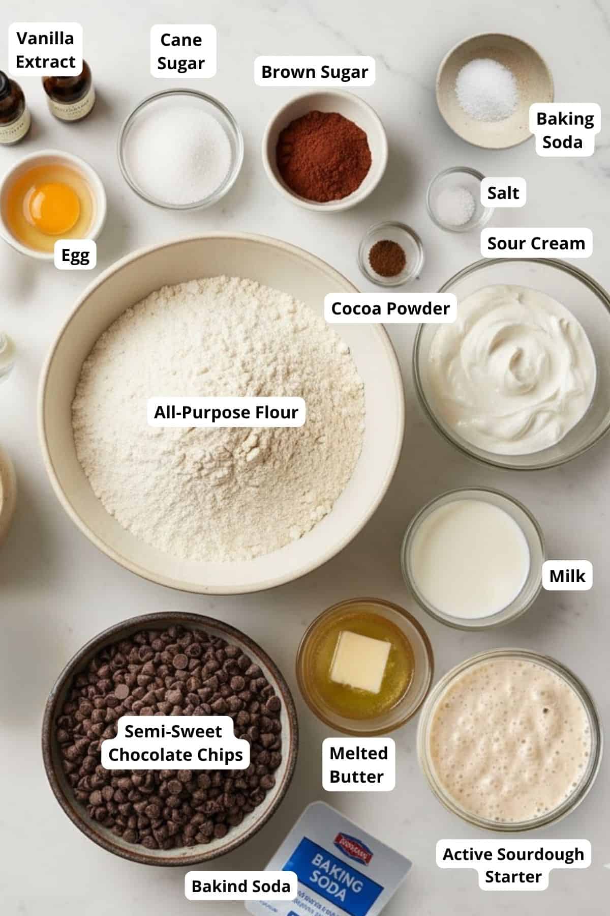 Ingredients for easy double chocolate sourdough muffins arranged on a countertop.