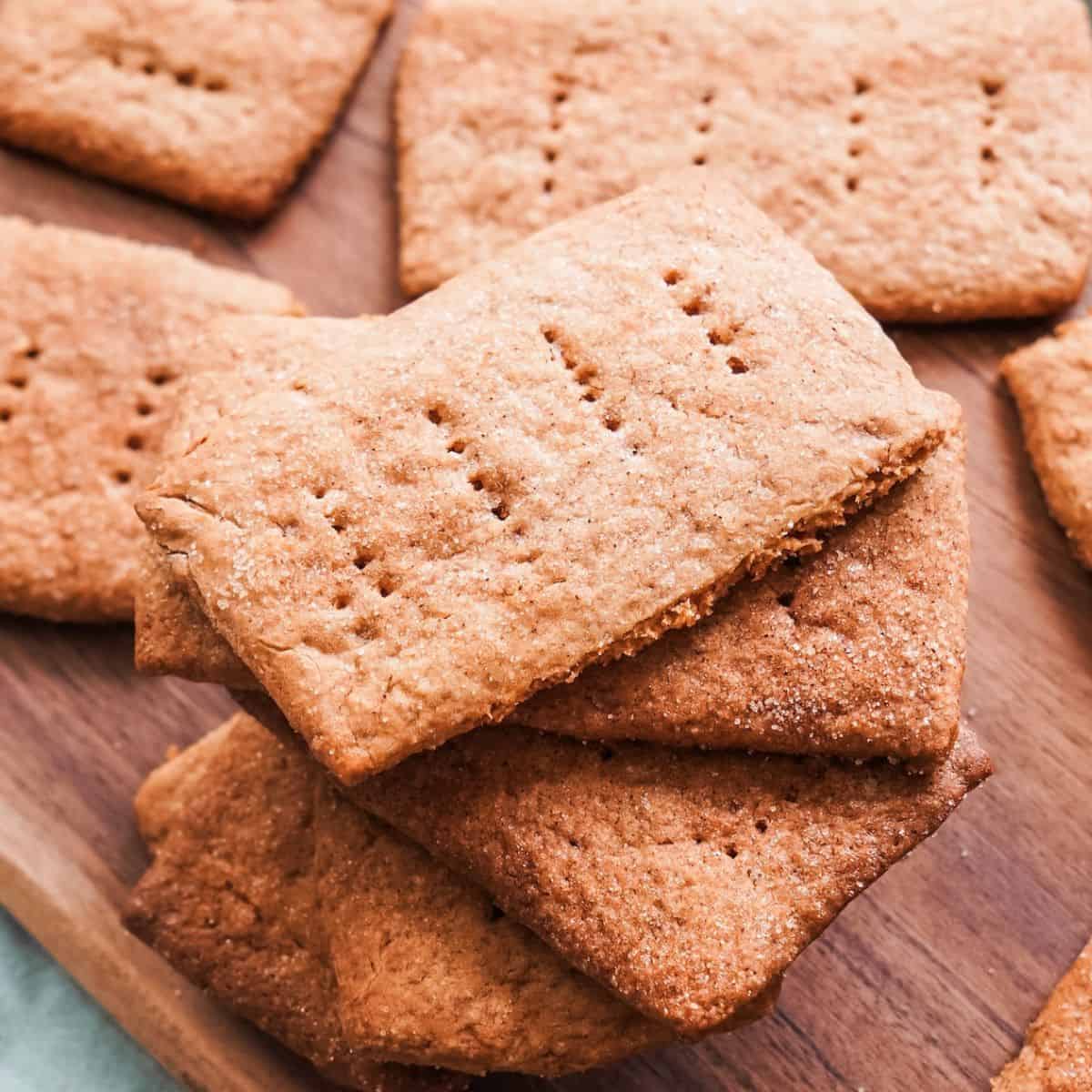 Sourdough graham crackers on a wooden board.