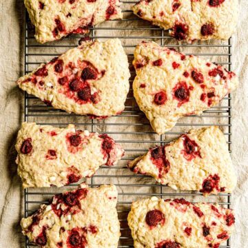 Just baked sourdough scones on a black wire rack.