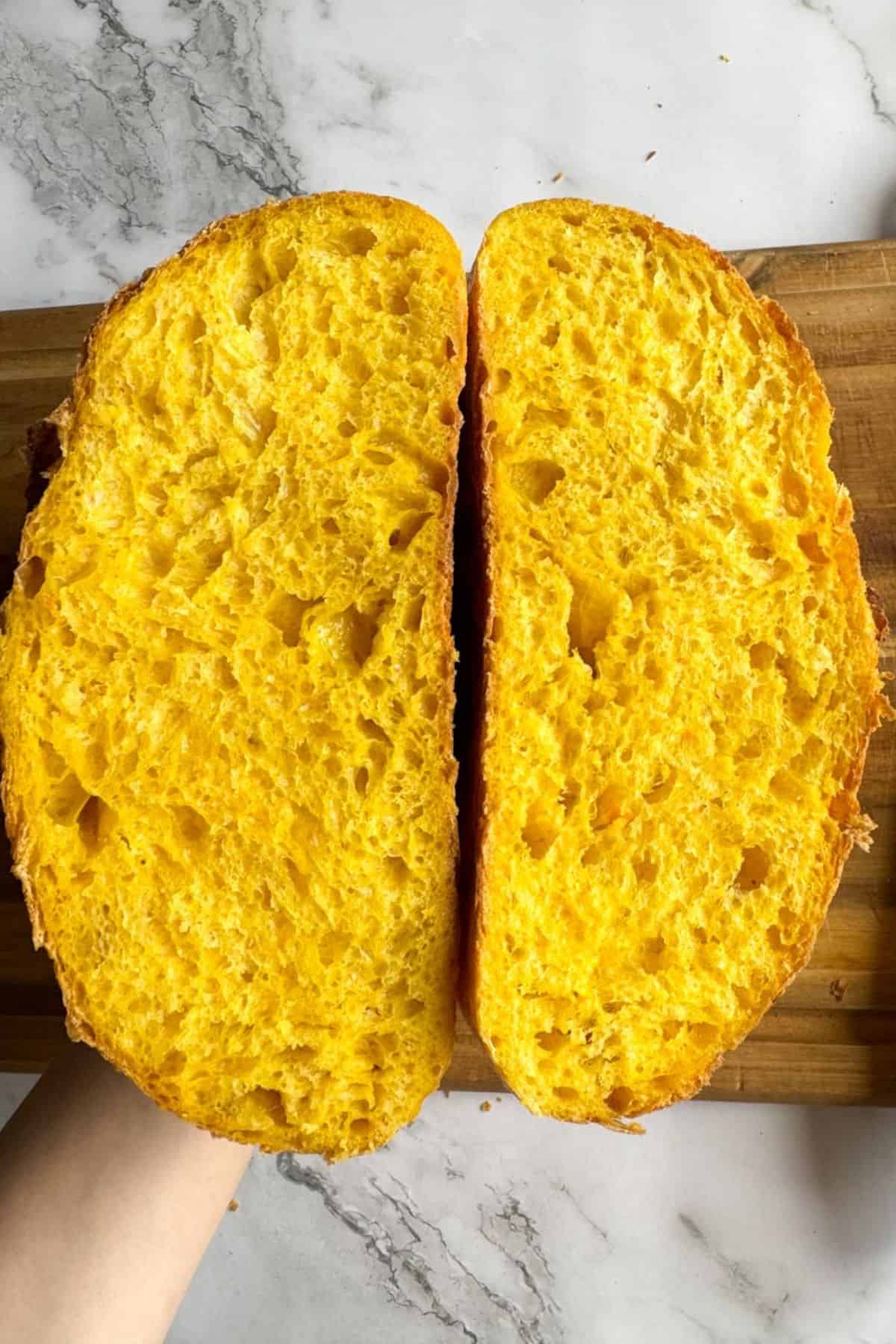 Sourdough pumpkin bread, cut in half.