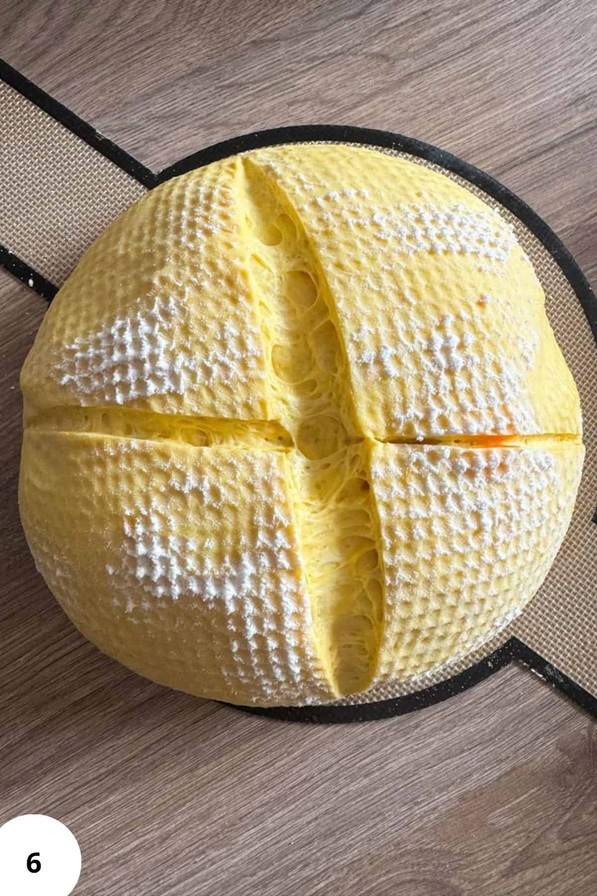 Dough of sourdough pumpkin bread on a bread mat.
