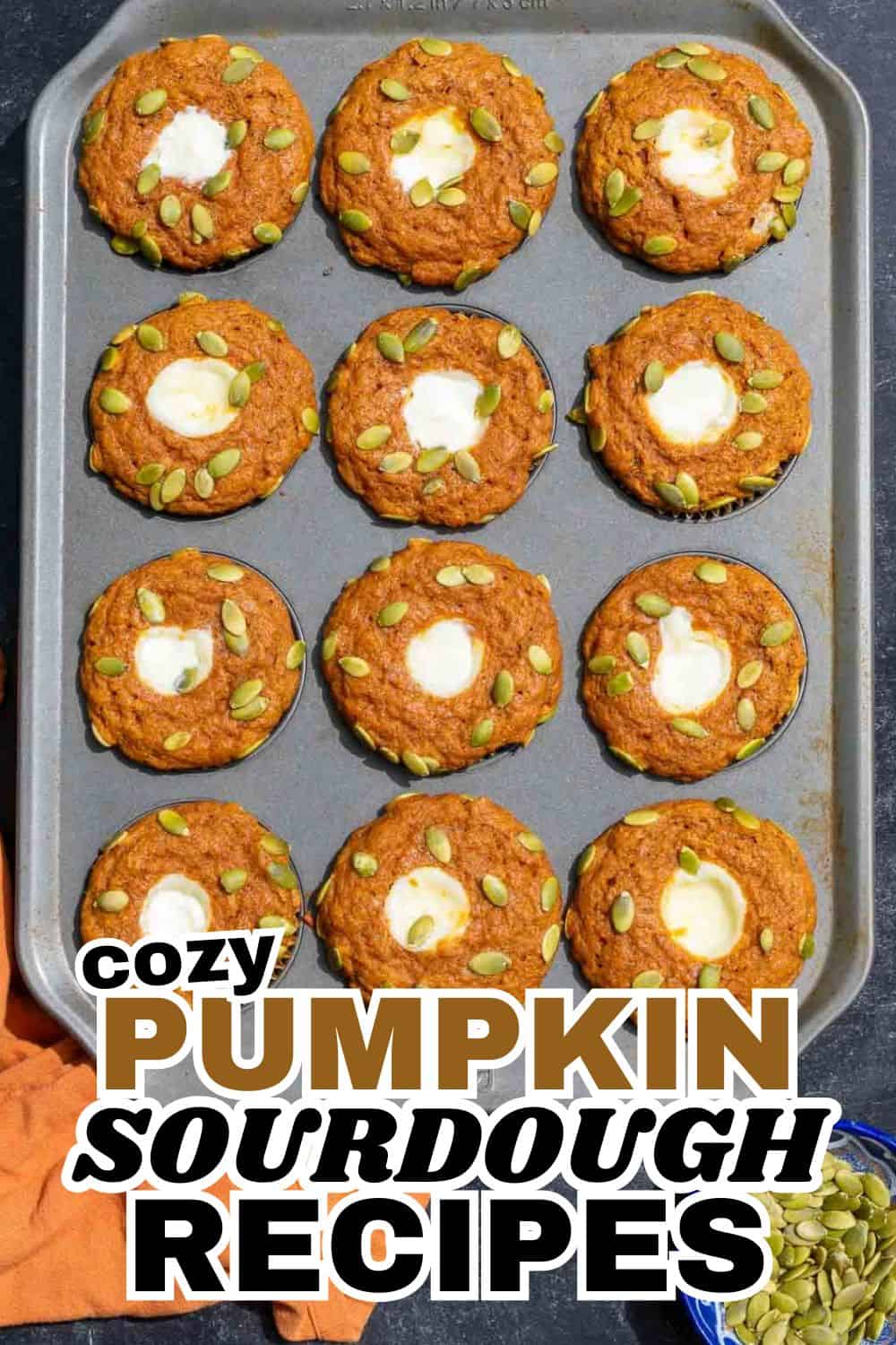 Fresh pumpkin sourdough cookies topped with pumpkin seeds on a baking sheet.
