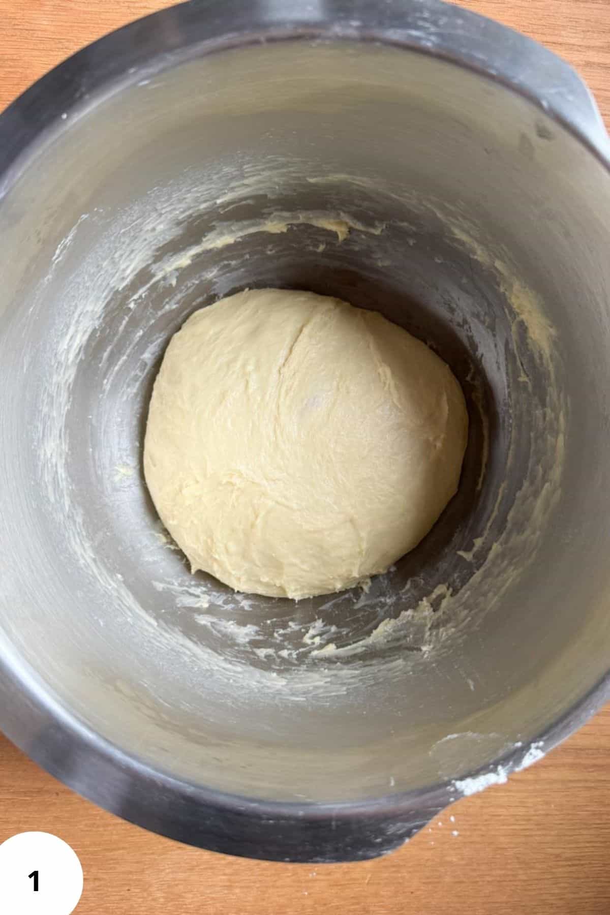 Dough resting in a large mixing bowl.