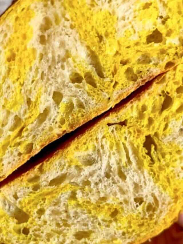 A crumb of a marbled turmeric sourdough bread.
