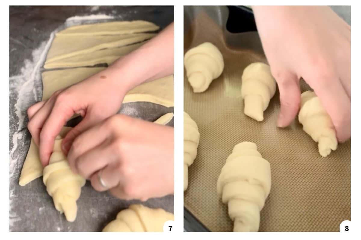 A hand rolling dough into a crescent shape before baking.