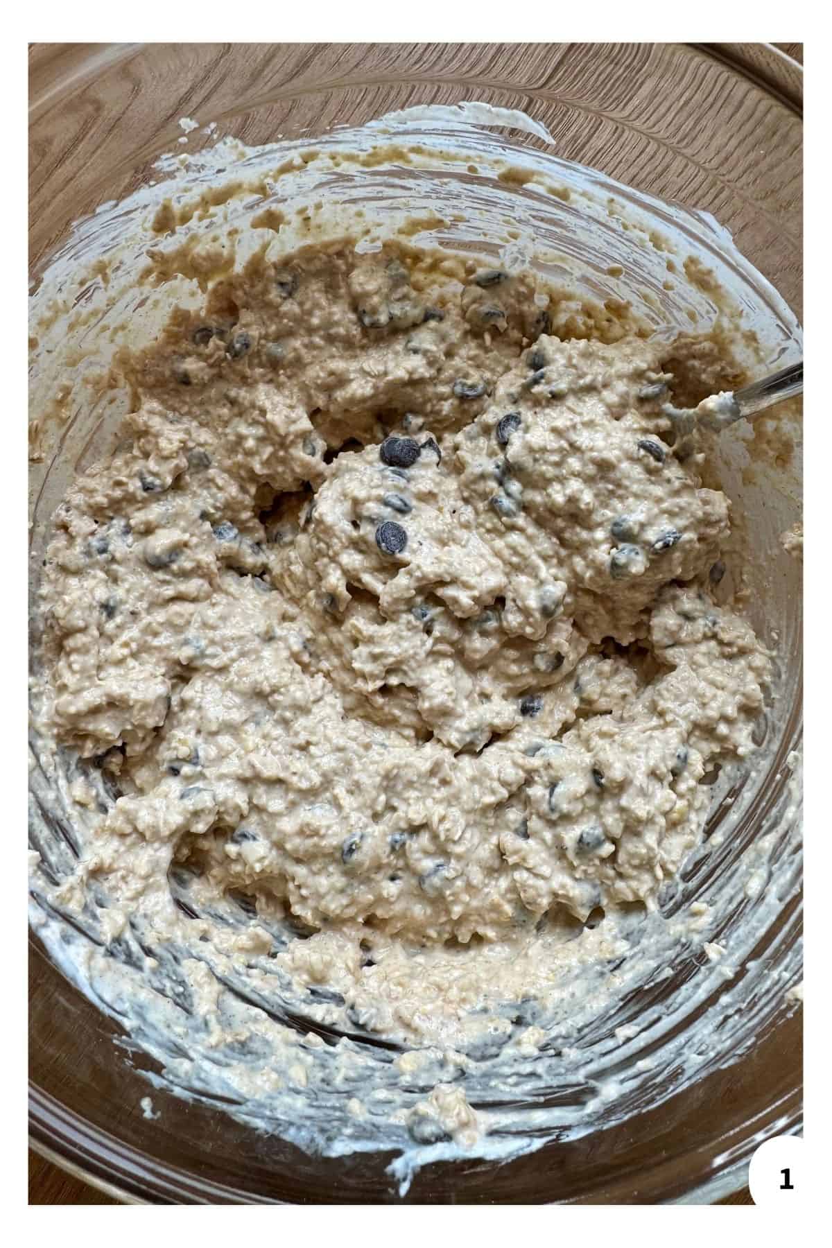 Ingredients being mixed in a large bowl.
