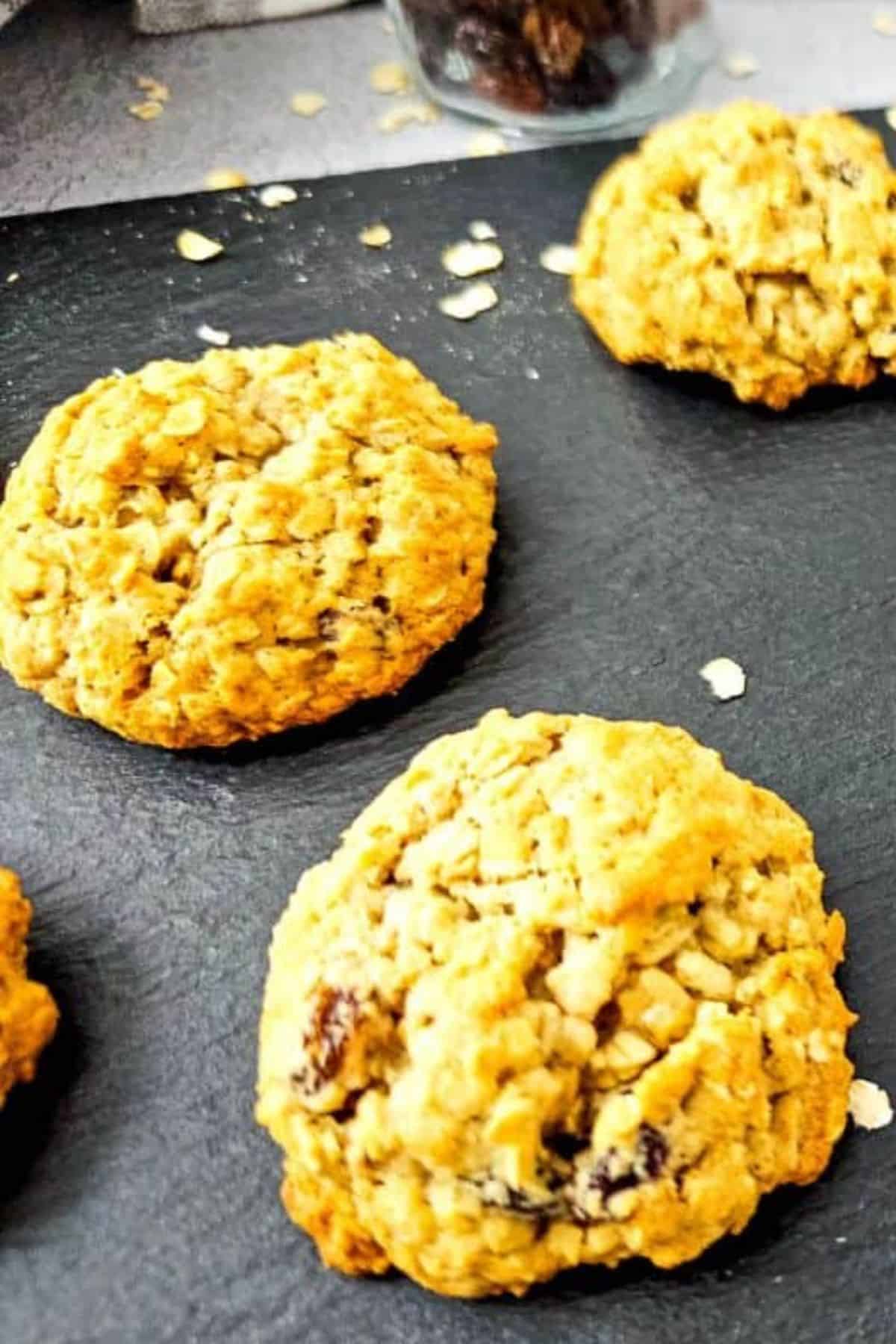 Close-up of oatmeal cookies being served, showing their soft and chewy texture.