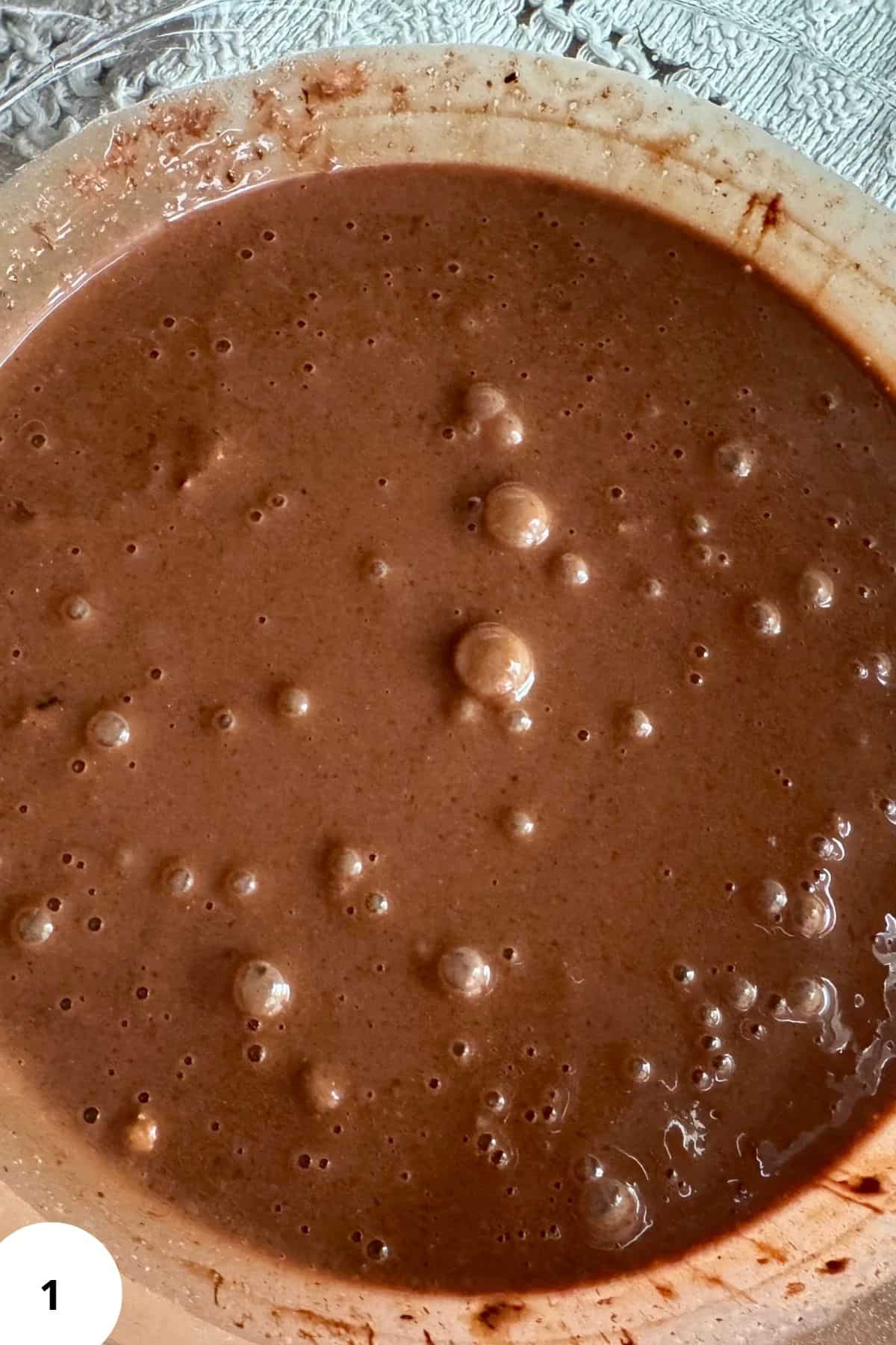 Melted chocolate mixture in a large bowl, smooth and glossy.