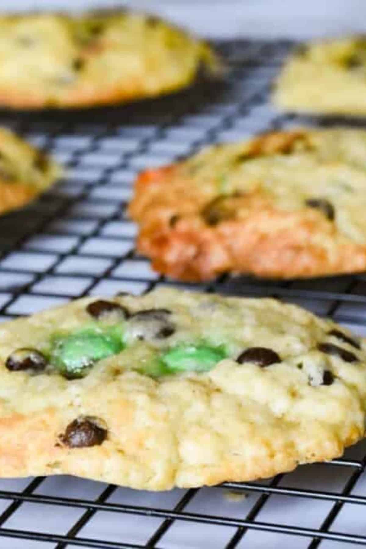 Cookies resting on a cooling wire rack.