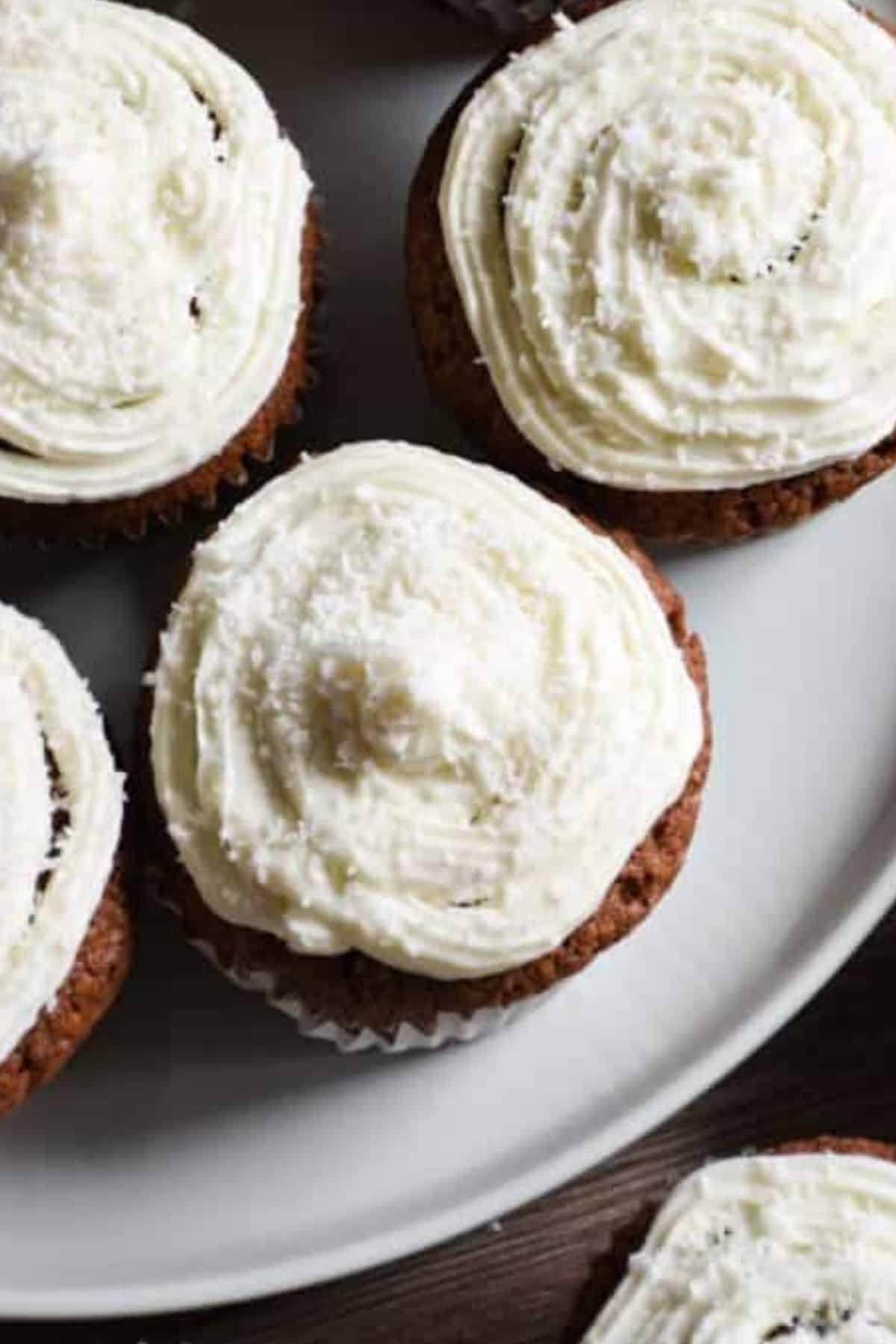 Coconutty sourdough discard chocolate cupcakes served on a plate.