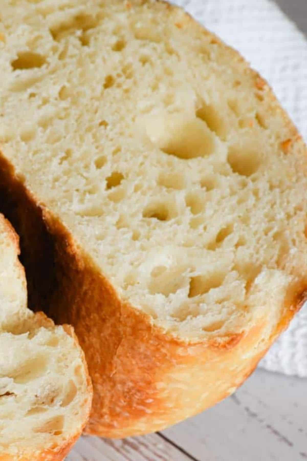Close-up of a single bread slice showing its airy interior.