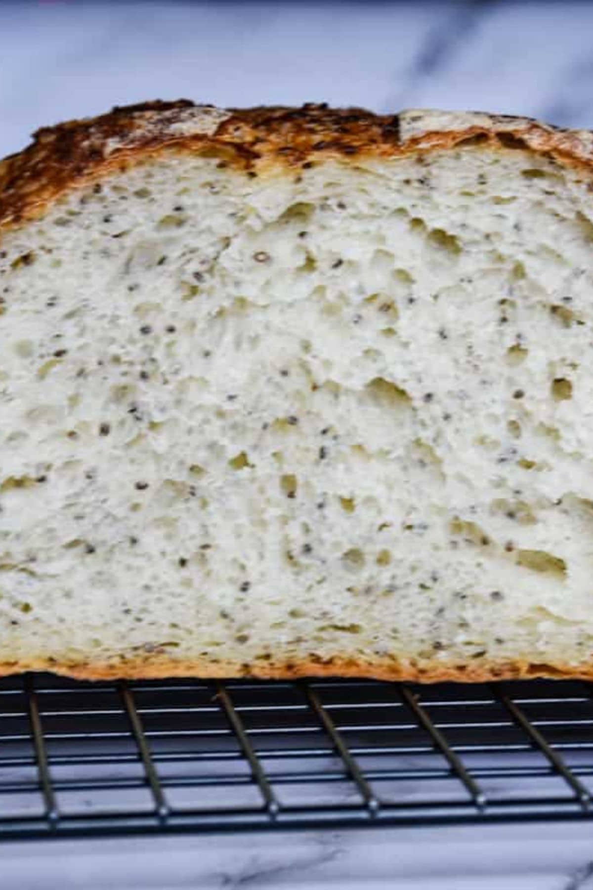 Close-up of a sliced bread piece revealing its open crumb and tender inner texture.