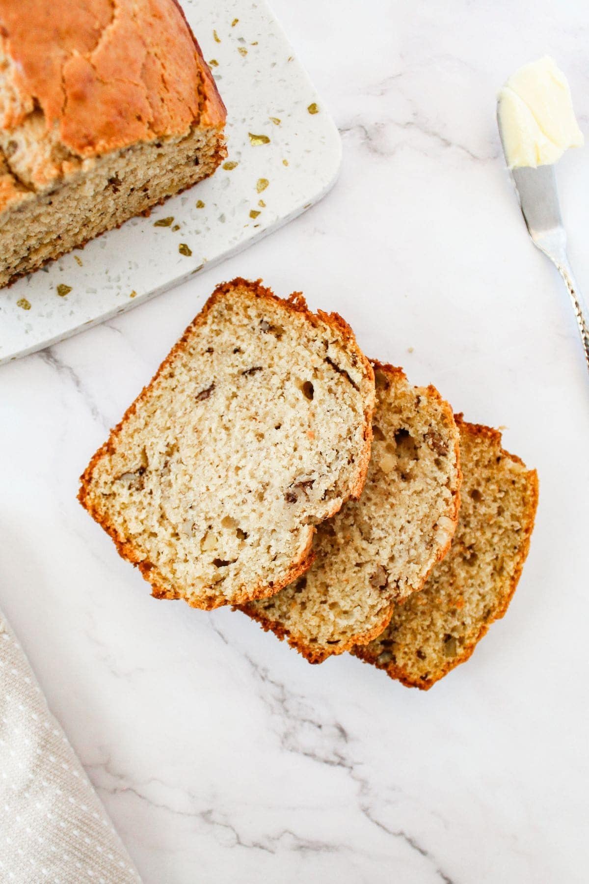 Sliced banana loaf bread on a surface.
