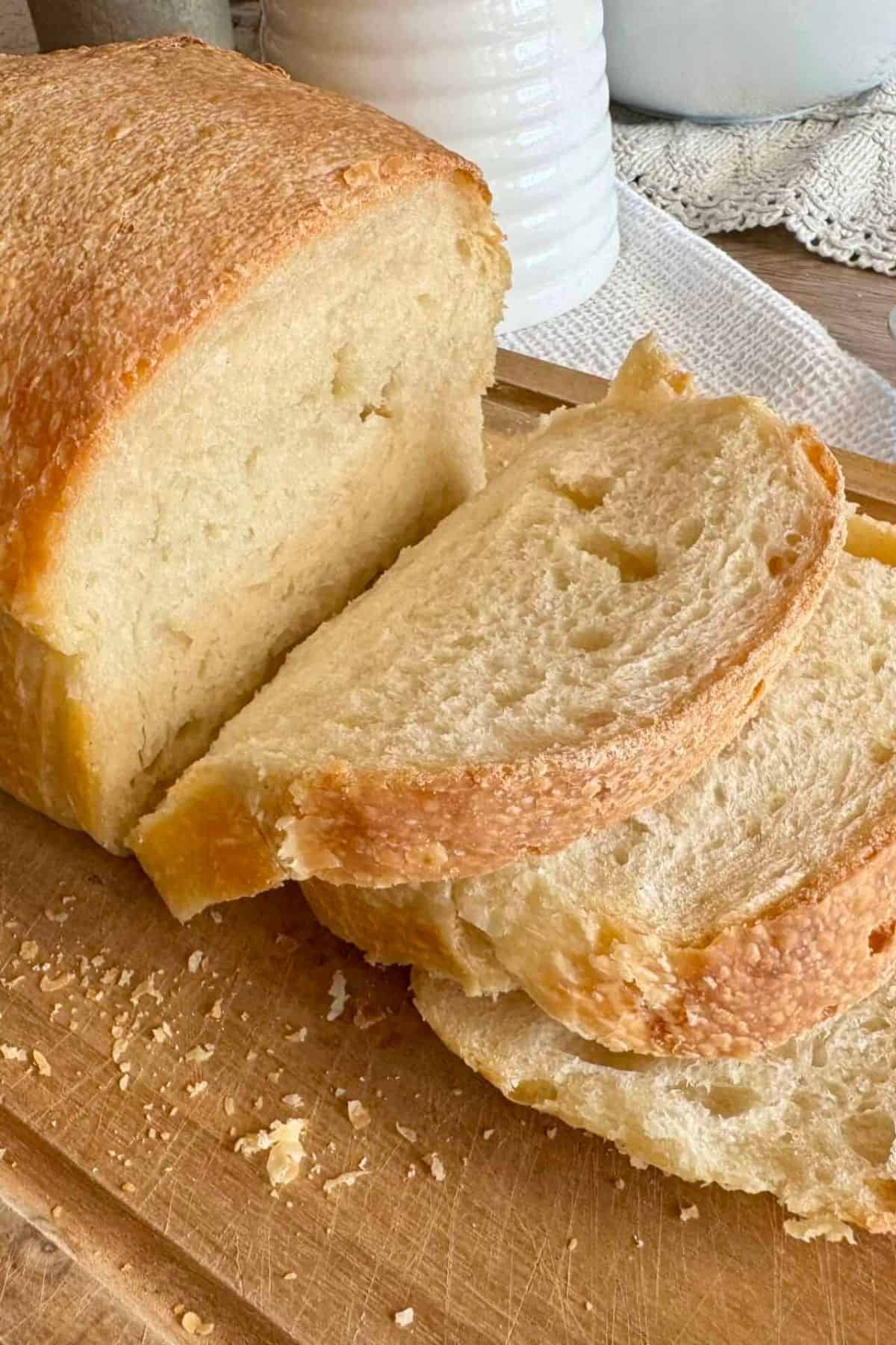 Slices of loaf arranged on a wooden board.