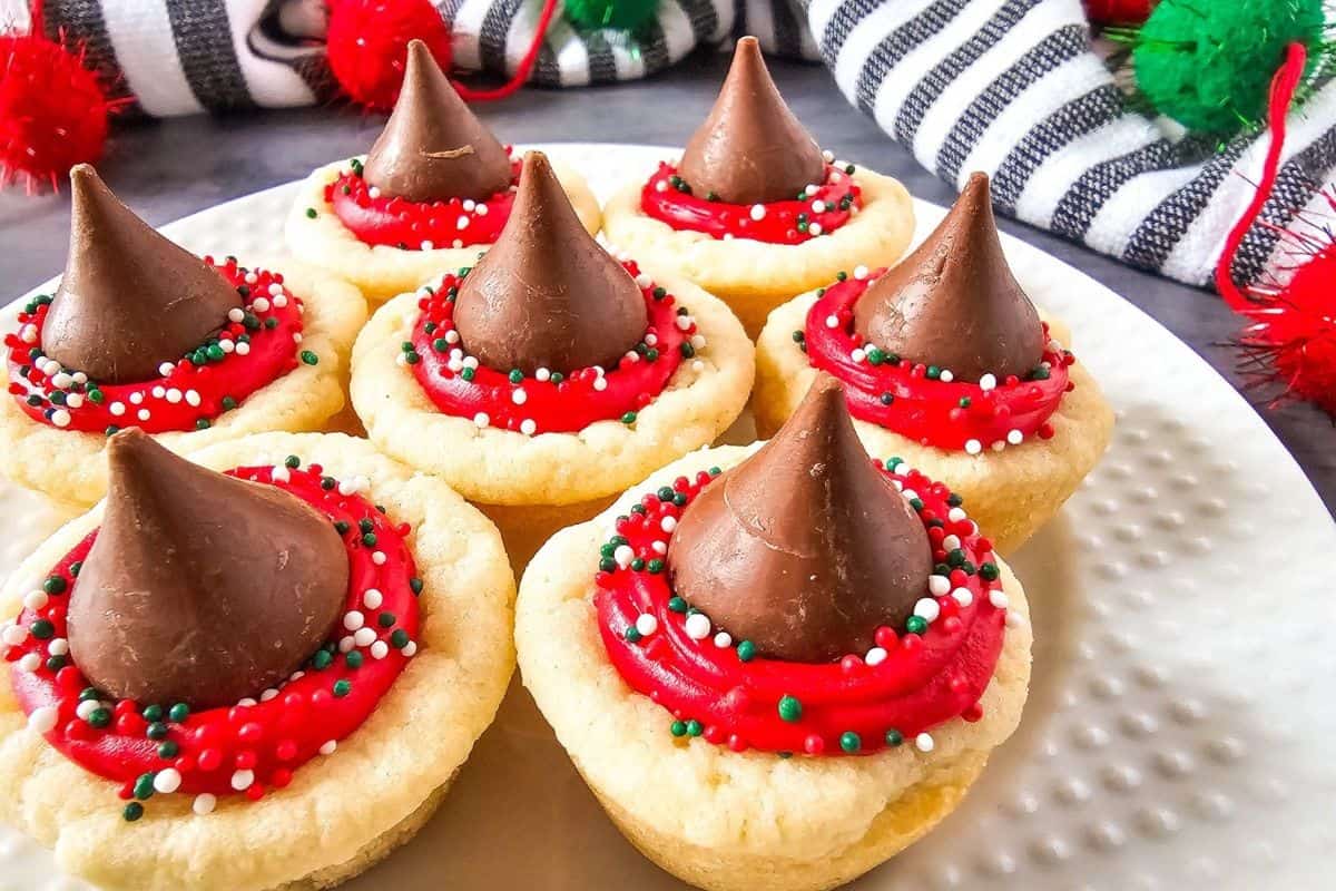 Frosted cookie cups neatly arranged on a plate, ready to serve.
