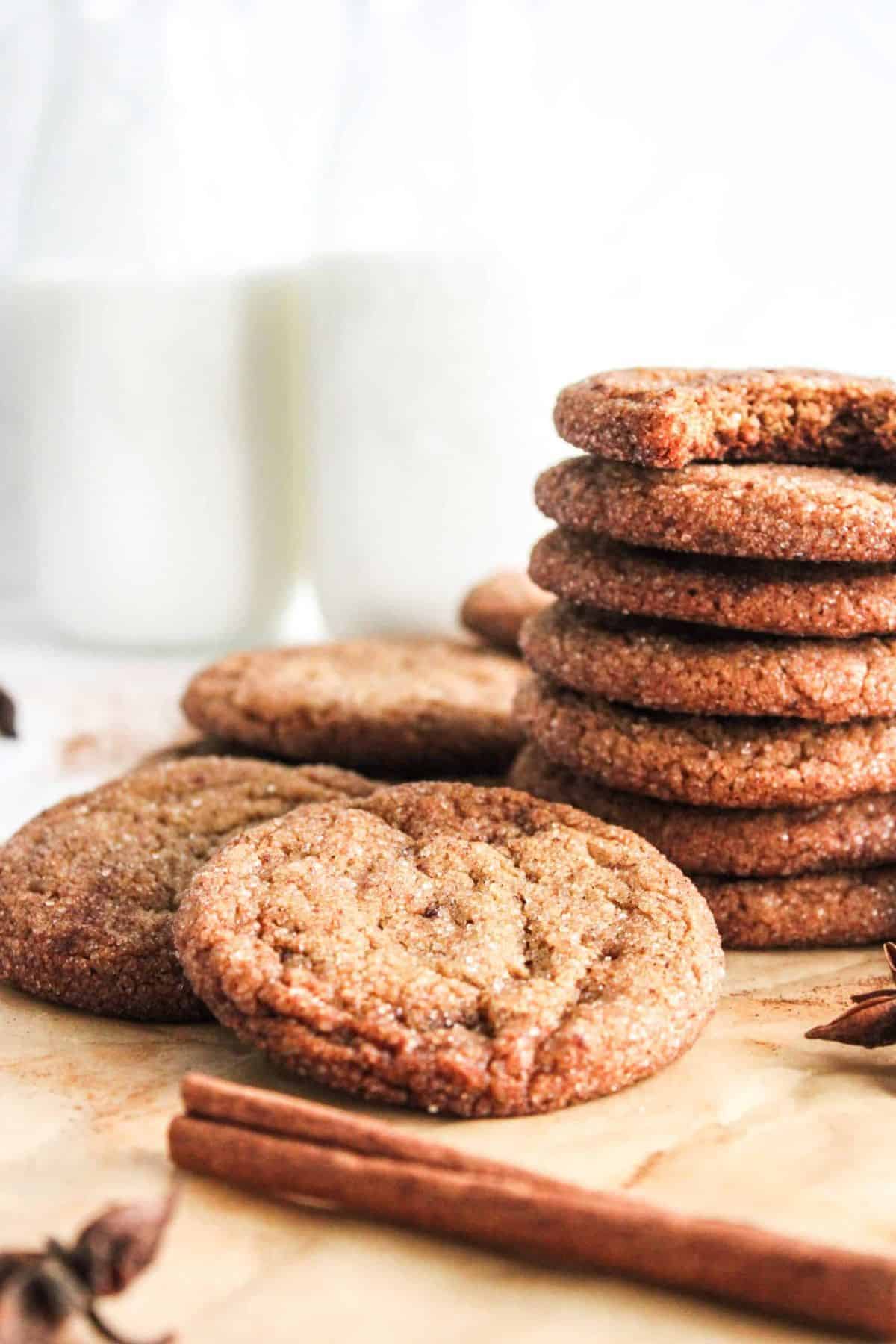 Old fashioned cookies stacked and served on a wooden board.