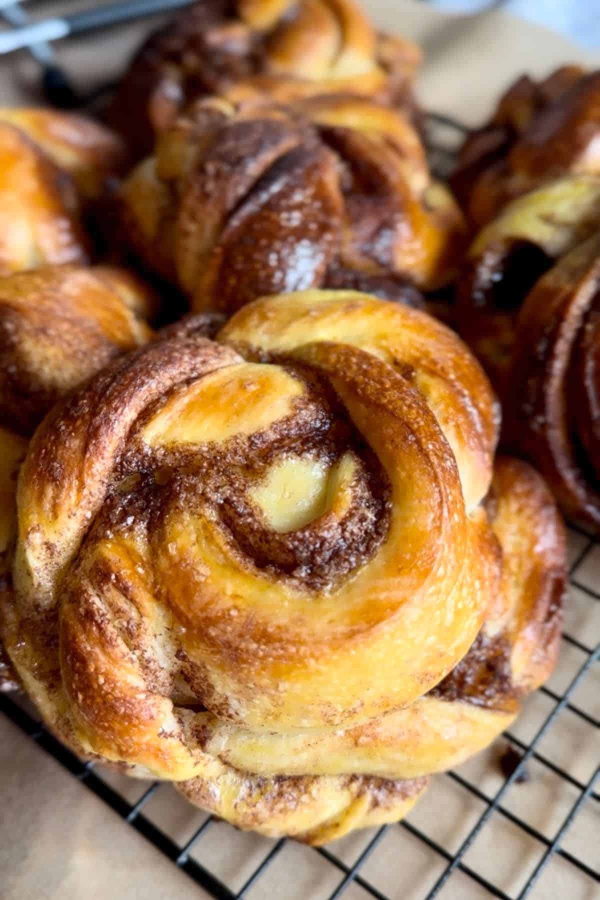Delicious cinnamon rolls with swirls, baked to golden perfection, featuring cinnamon and sugar filling.