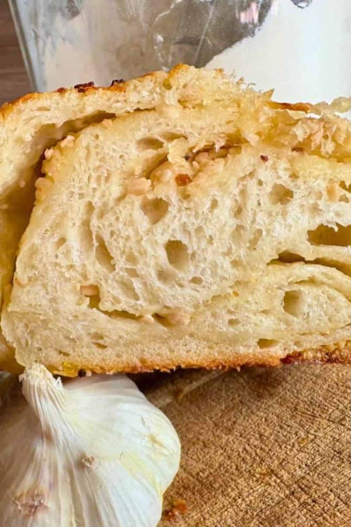 Delicious homemade sourdough bread featuring an open crumb and light, airy texture, perfect for breakfast or sandwiches.