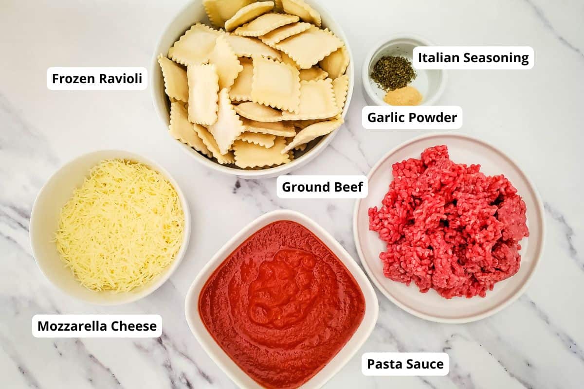 Ingredients in making 4-Ingredient ravioli lasagna casserole arranged in a surface.