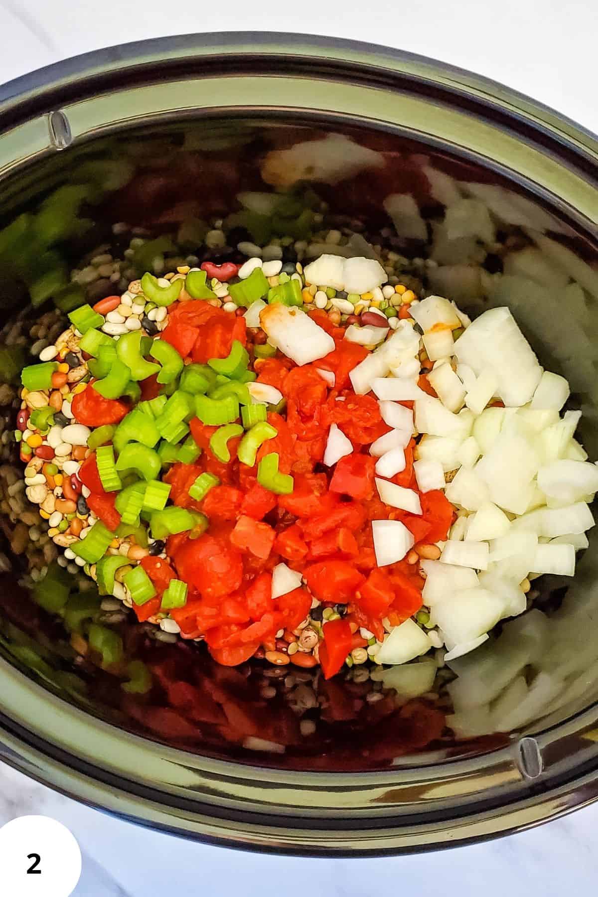 Ingredients mixed together in a crockpot, ready to cook.
