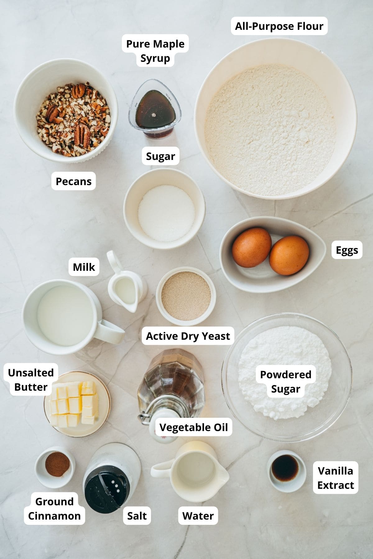 Ingredients for maple glazed donuts neatly arranged on a surface.