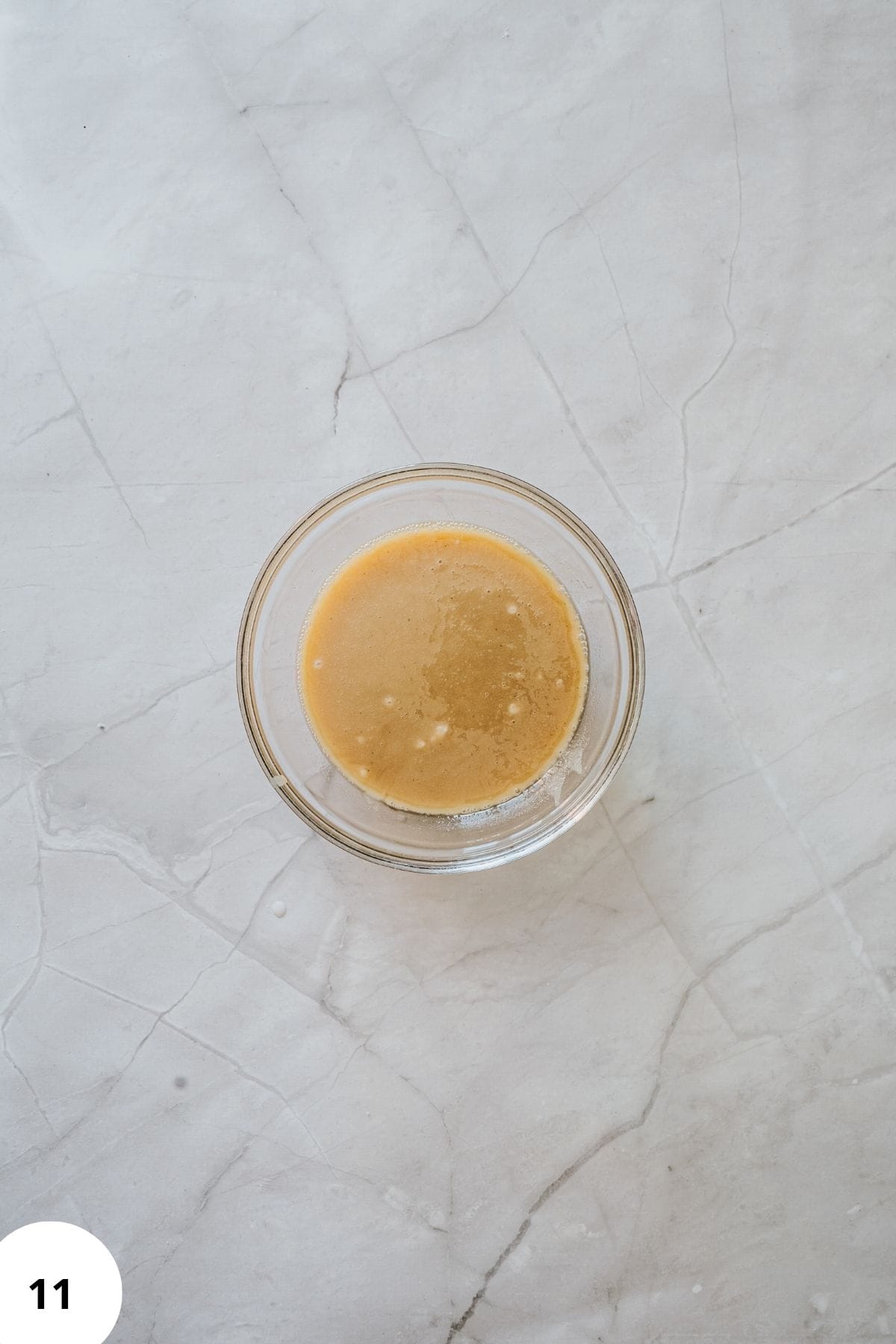 Small bowl with maple glaze ingredients mixed until smooth.