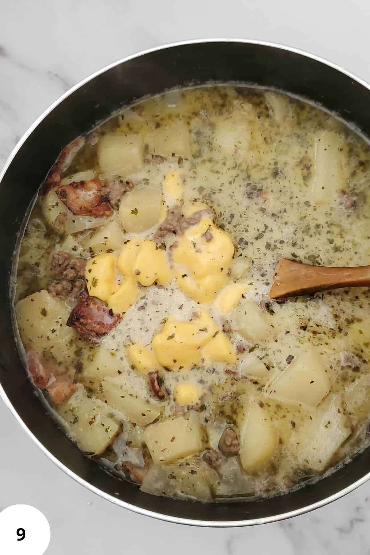 Cheeseburger ingredients soaking in a pot.