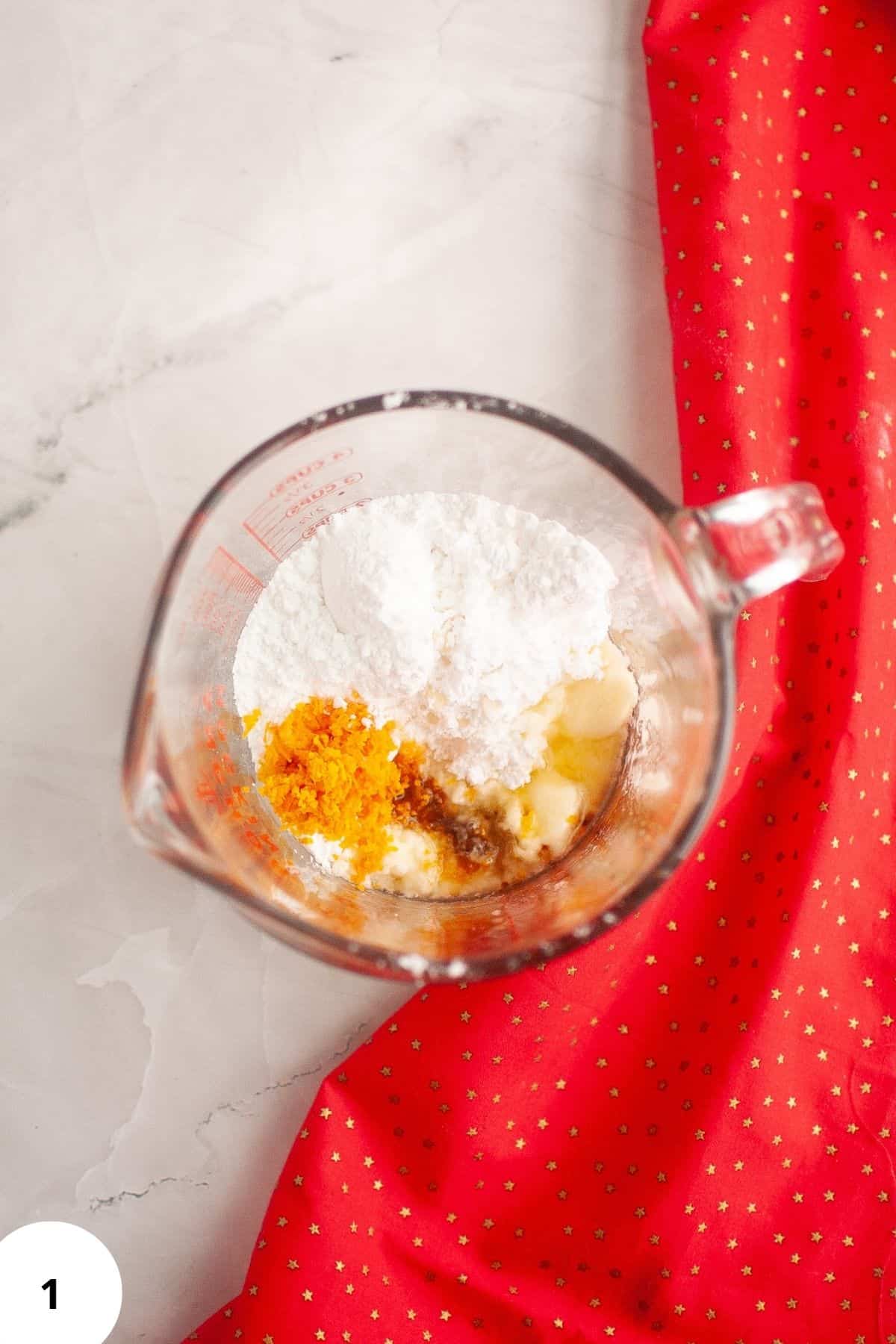 Ingredients being mixed in a mixer bowl.